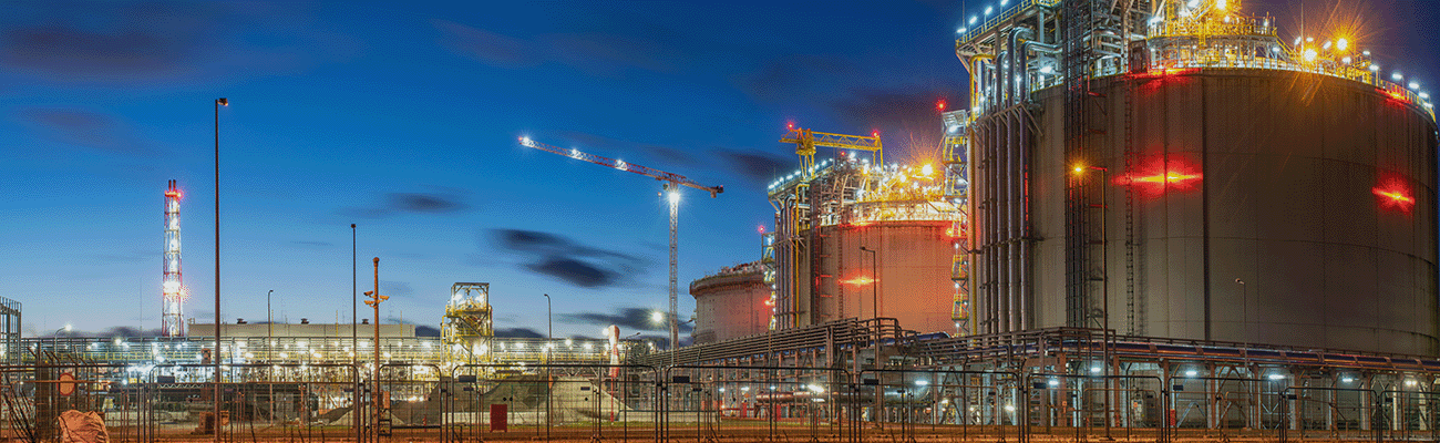 Image of a Gas Plant with its lights on at night